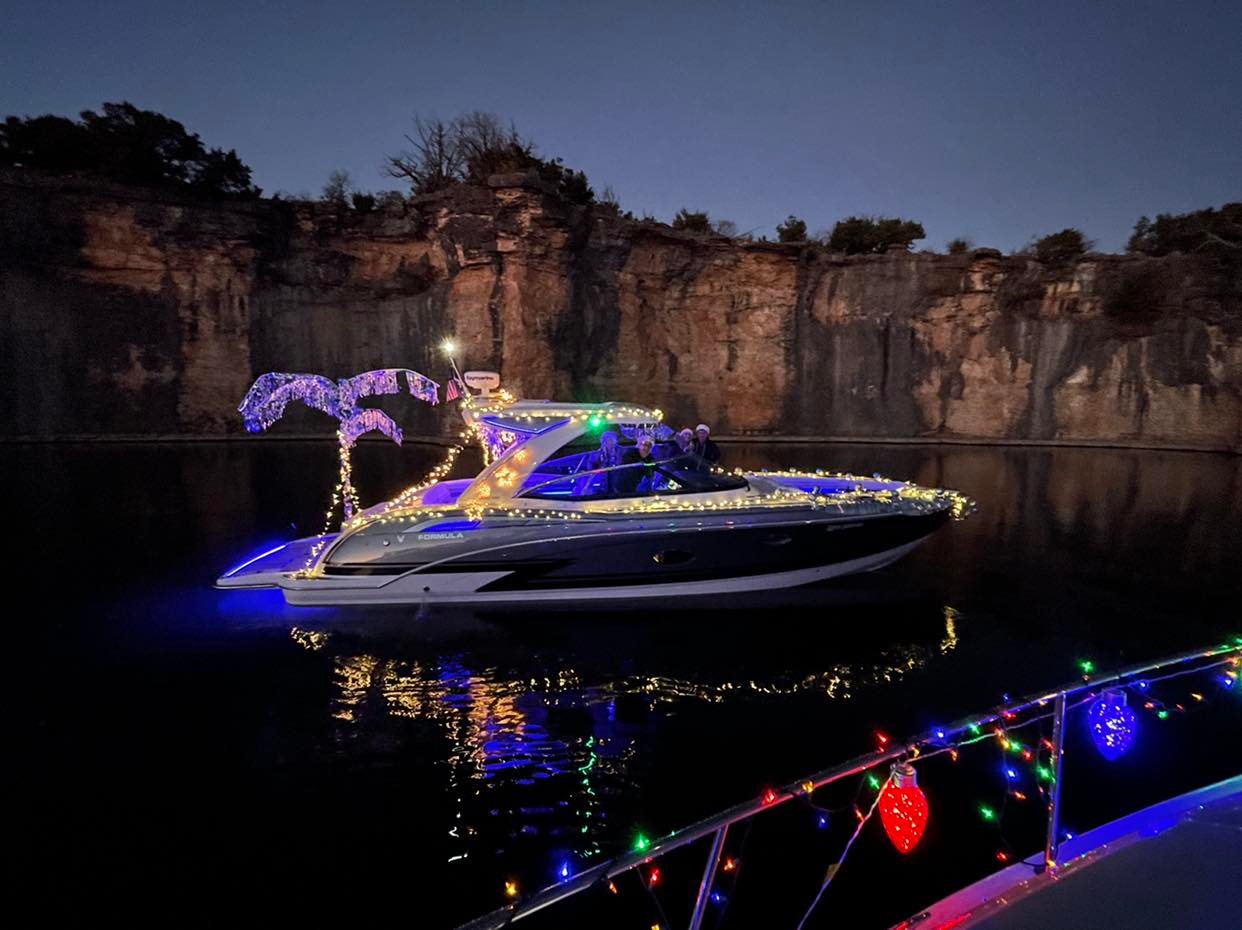 A boat with lights on it in the water.