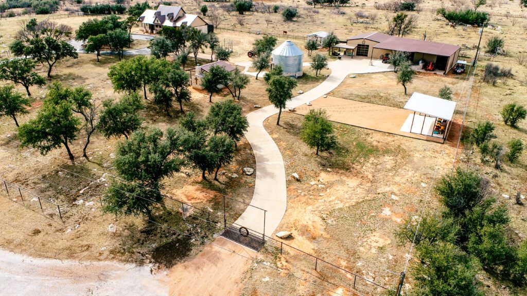 A bird 's eye view of an area with trees and a walkway.