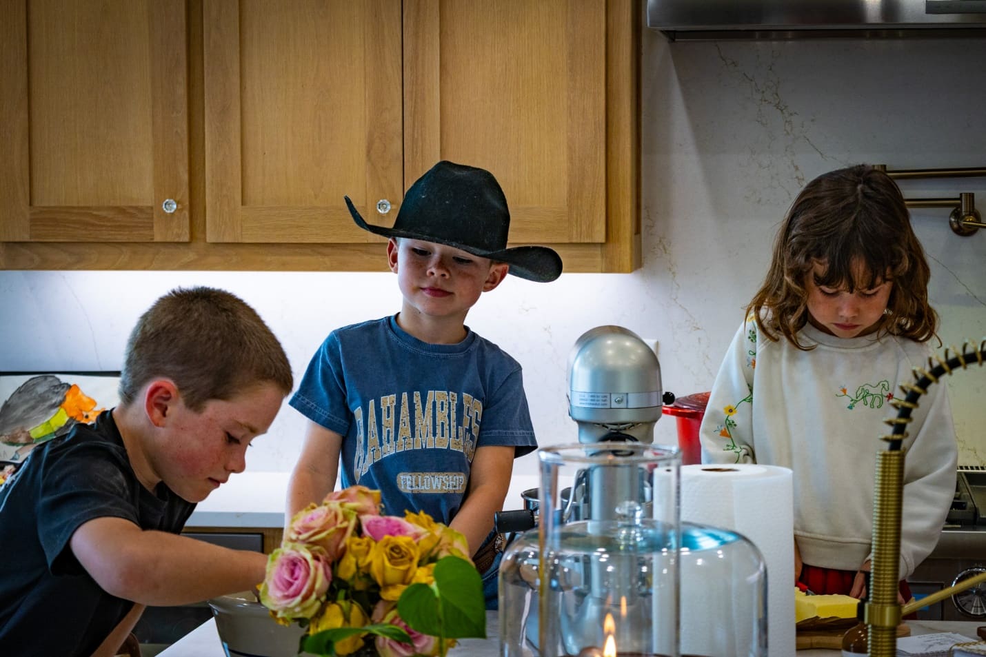 All three of the Avidon Kids help Claire make all natural chocolate chip cookies.