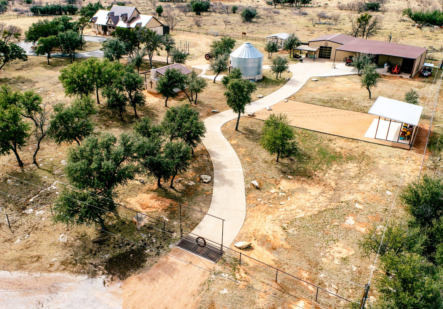 A bird 's eye view of an area with trees and a walkway.
