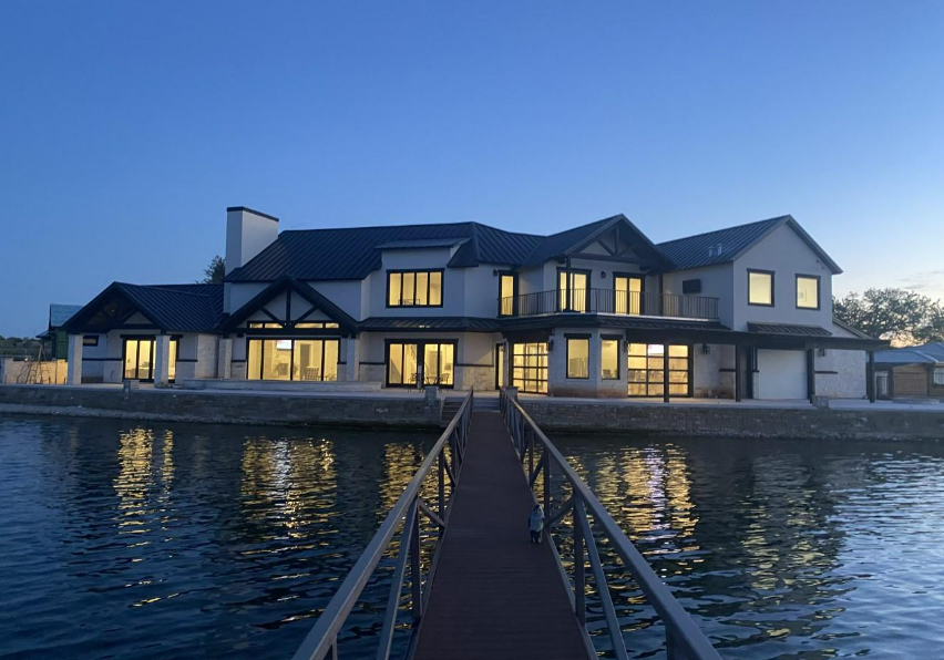 A large house with a dock in front of it