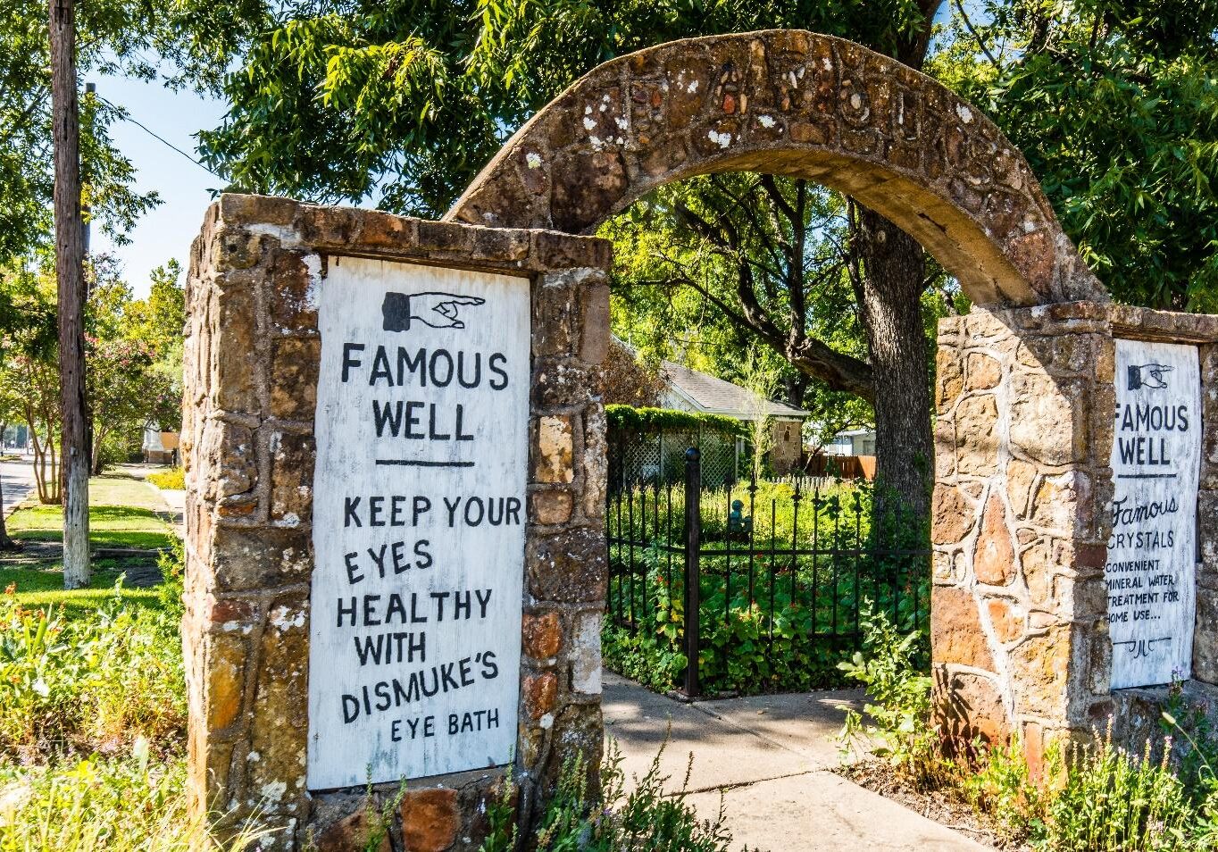 A sign that says famous well and keep your eyes healthy with dislikes eye bath.